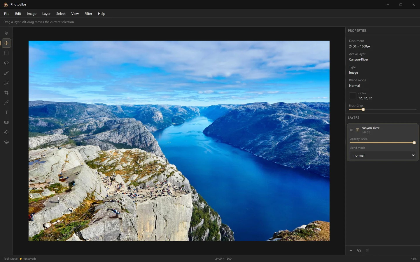 The Photovibe photo editor on Windows: menu bar, tool column, canvas with a landscape photo open, and the properties and layers panels